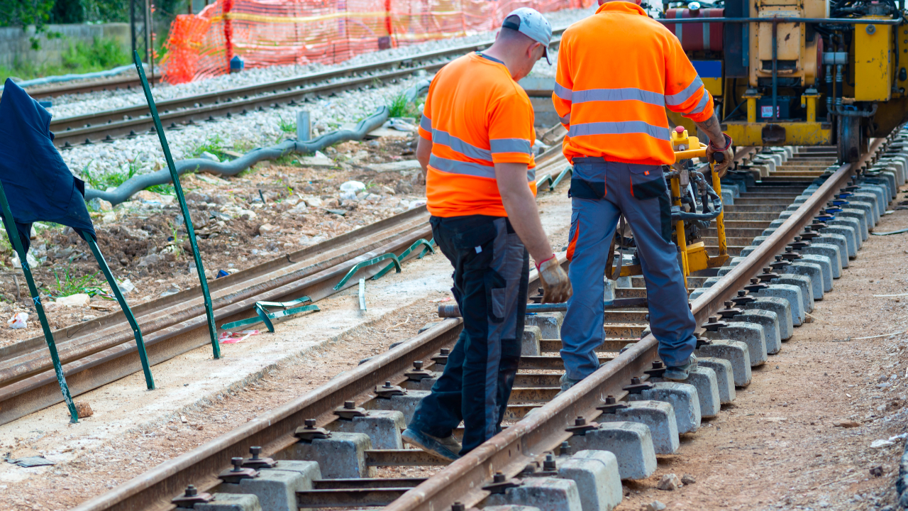 personnel fixing rail tracks